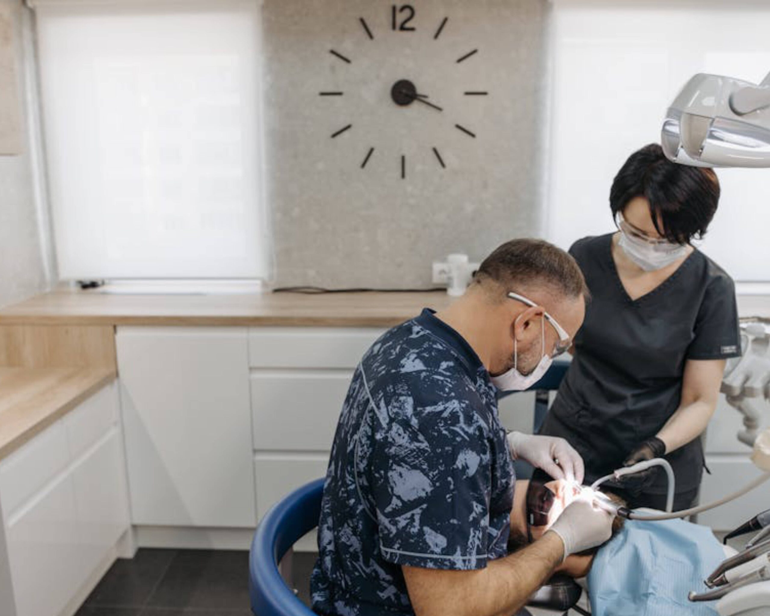Dental professionals treating a patient with a cracked tooth.